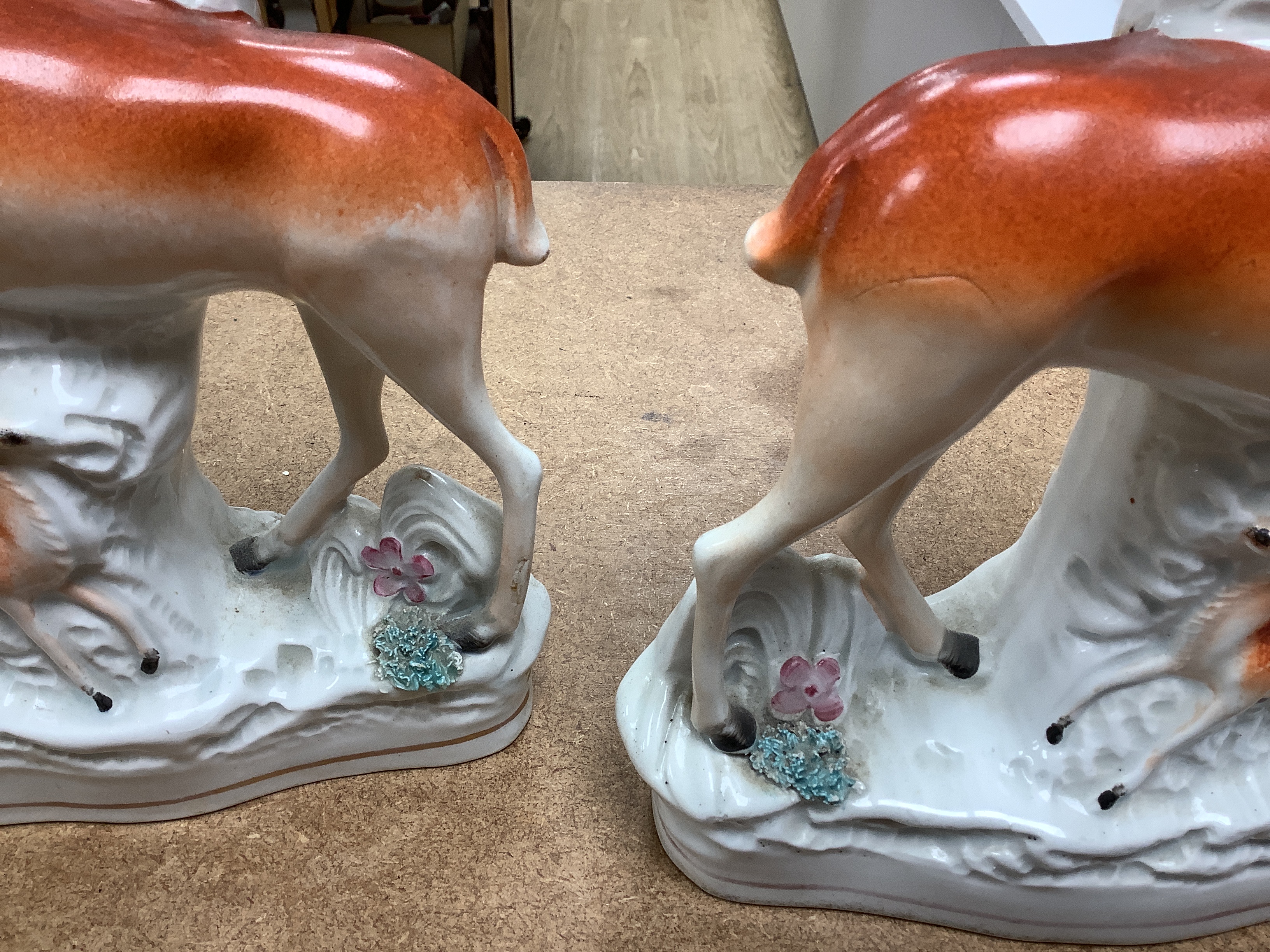 A pair of Coalport vases and covers and a pair of Staffordshire deer spill vases, largest 29cm high